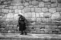 Woman in Front of Incan Wall (Peru)