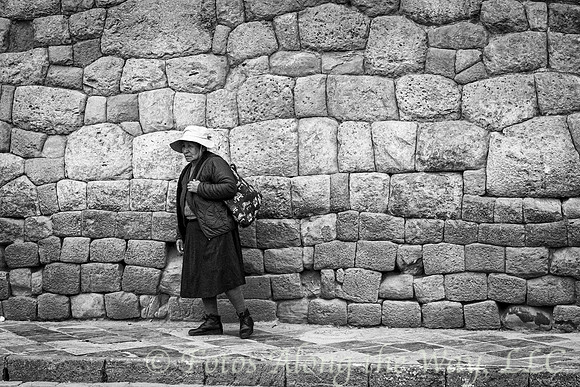 Woman in Front of Incan Wall (Peru)