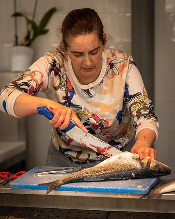 Woman Preparing Fish at the Market (2023)