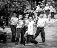 Boys gesturing in front of their school (Java, Indonesia, 2018)
