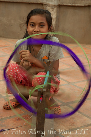 Girl Weaving Silk (Cambodia)