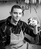 Young Woodworker Holding Carving (Bulgaria, 2024)