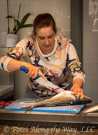 Woman Preparing Fish at the Market (Portugal)