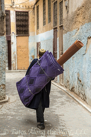 Man Carrying Purple Carpet (Morocco)