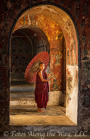 Young Monk with Umbrella in Hallway (Myanmar)