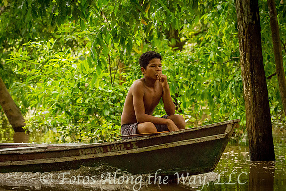 Pensive Teen in Canoe (Amazonia, Brazil)