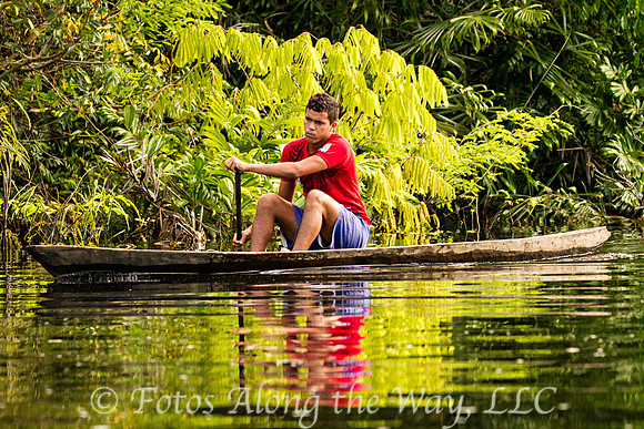 Young Man in Dugout Canoe (Amazonia, Brazil)