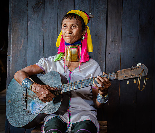 Kayan Musician Playing Worn Guitar (2017)